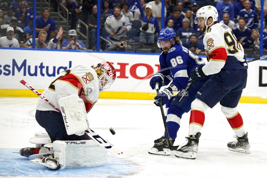 Chris O'MEara Florida Panthers right wing Patric Hornqvist (70) makes a save on a shot by Tampa Bay Lightning right wing Nikita Kucherov (86) as Panthers' Maxim Mamin (98) defends during the second period in Game 4 of an NHL hockey second-round playoff series Monday, May 23, 2022, in Tampa, Fla. (AP Photo/Chris O'Meara)