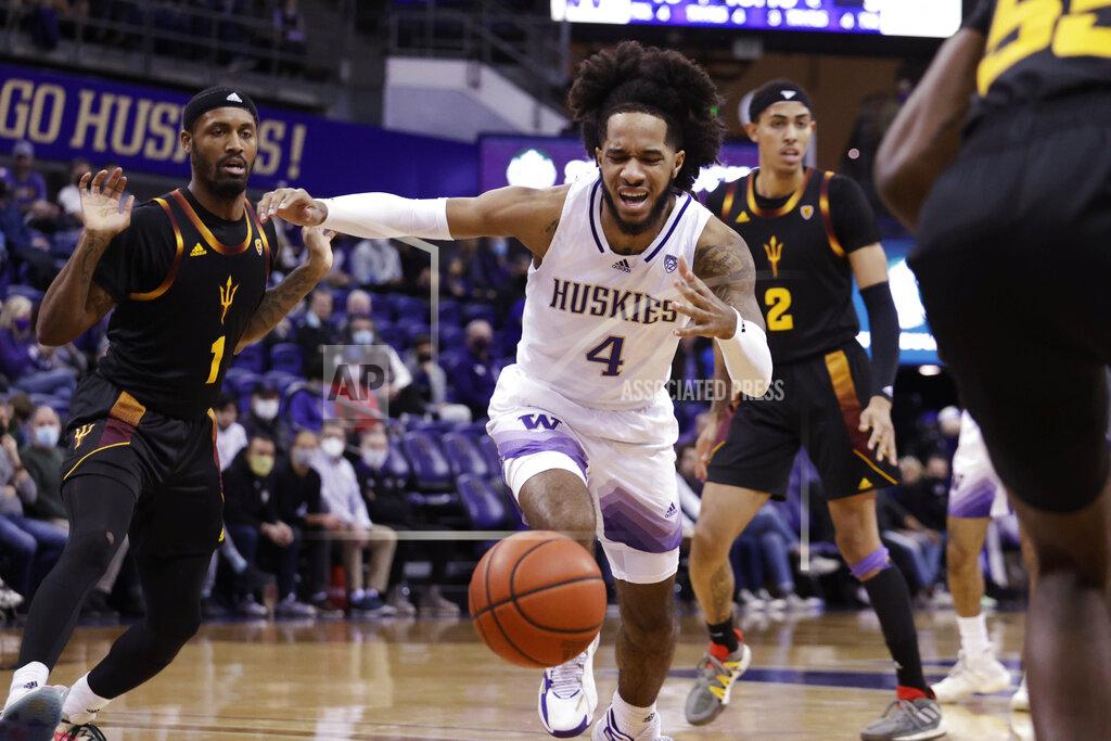 John Froschauer Washington's PJ Fuller and Arizona State's Luther Muhammad (1) and Jalen Graham (2) chase the ball during the first half of an NCAA college basketball game Thursday, Feb. 10, 2022, in Seattle. (AP Photo/John Froschauer)