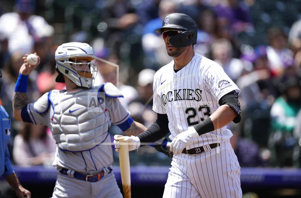 David Zalubowski Colorado Rockies' Kris Bryant, right, reacts after striking out against New York Mets starting pitcher Taijuan Walker as catcher Mets catcher Tomas Nido, left, puts the ball back into play in the first inning of a baseball game Sunday, May 22 2022, in Denver. (AP Photo/David Zalubowski)