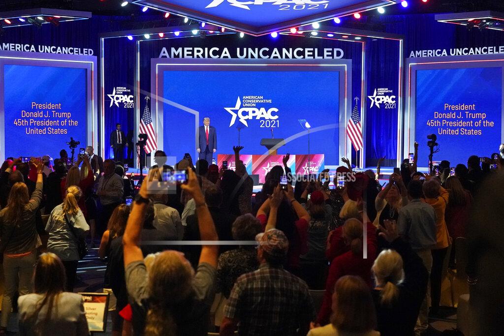 John Raoux Supporters cheer and wave as former president Donald Trump is introduced at the Conservative Political Action Conference (CPAC) Sunday, Feb. 28, 2021, in Orlando, Fla. (AP Photo/John Raoux)