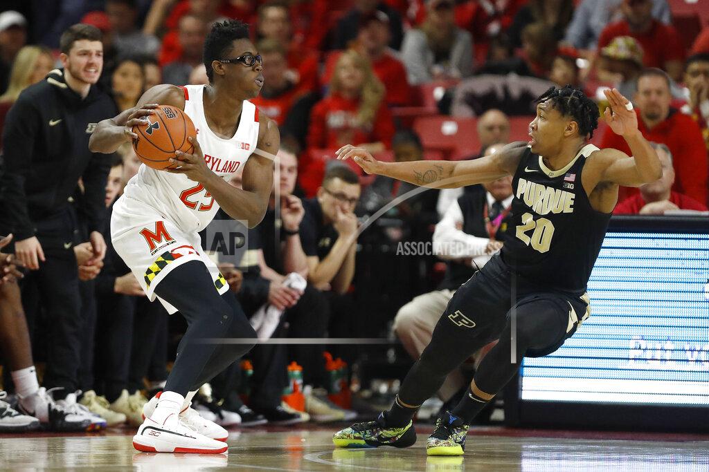 Julio Cortez Maryland forward Jalen Smith, left, looks for an open teammate against Purdue guard Nojel Eastern (20) during the first half of an NCAA college basketball game, Saturday, Jan. 18, 2020, in College Park, Md. (AP Photo/Julio Cortez)