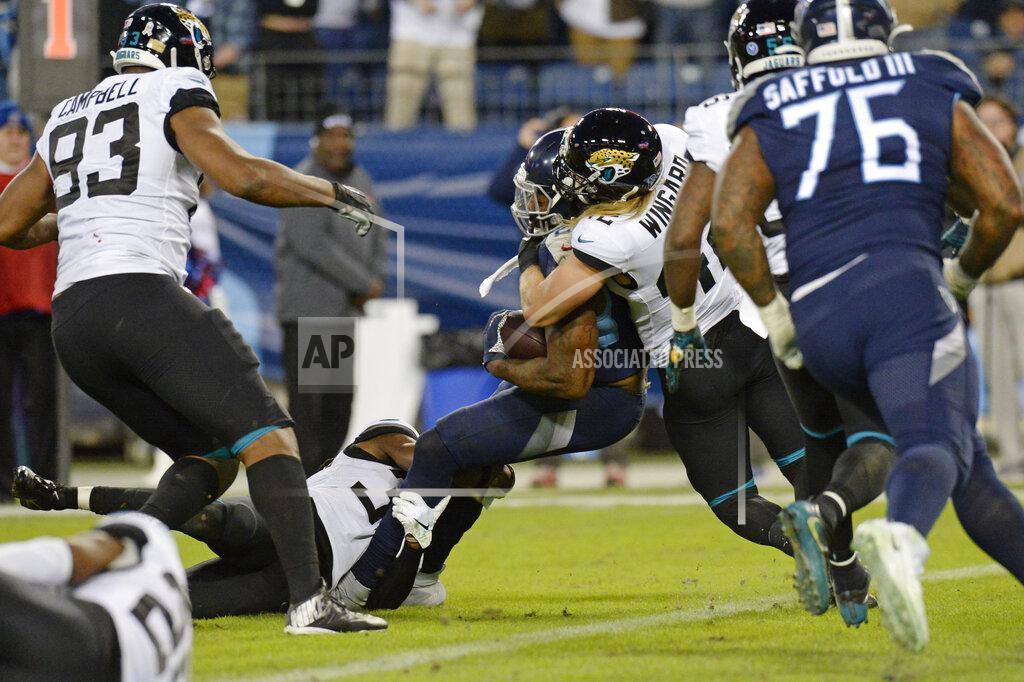 Mark Zaleski Tennessee Titans running back Derrick Henry, center, pushes against Jacksonville Jaguars safety Andrew Wingard (42) as Henry scores a touchdown in the second half of an NFL football game Sunday, Nov. 24, 2019, in Nashville, Tenn. (AP Photo/Mark Zaleski)