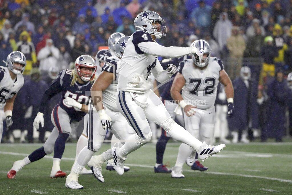 Elise Amendola Dallas Cowboys quarterback Dak Prescott follows through on a pass under pressure from New England Patriots defensive end Chase Winovich, left, in the second half of an NFL football game, Sunday, Nov. 24, 2019, in Foxborough, Mass. (AP Photo/Elise Amendola)