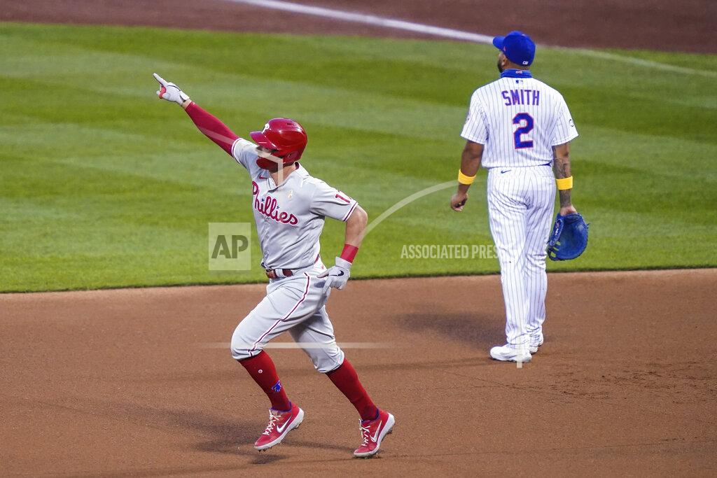 John Minchillo Philadelphia Phillies' Rhys Hoskins celebrates as he runs the bases past New York Mets first baseman Dominic Smith (2) after hitting a solo home run off starting pitcher Seth Lugo during the first inning of a baseball game Saturday, Sept. 5, 2020, in New York. (AP Photo/John Minchillo)