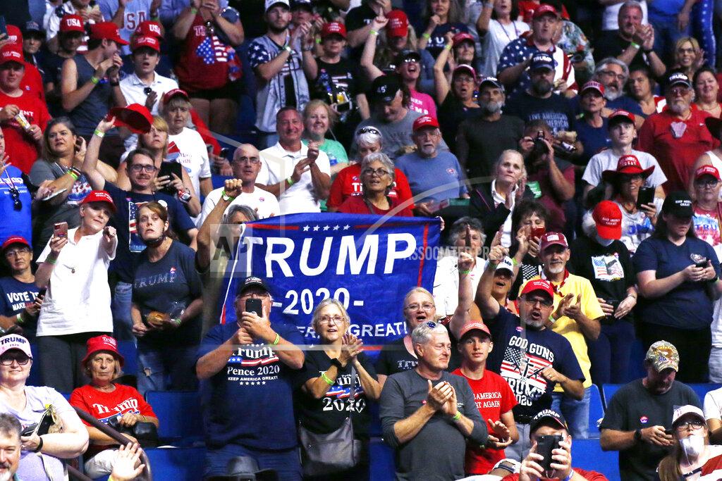 Sue Ogrocki President Donald Trump supporters cheer Eric Trump, the son of President Donald Trump, not pictured, before a Trump campaign rally in Tulsa, Okla., Saturday, June 20, 2020. (AP Photo/Sue Ogrocki)