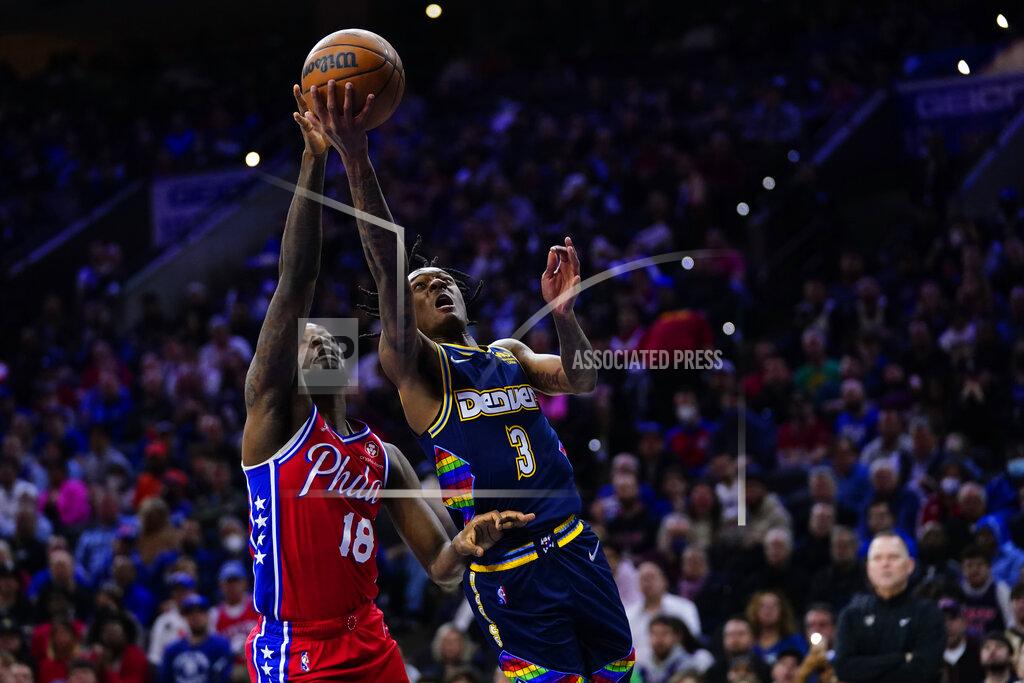 Matt Slocum Denver Nuggets' Bones Hyland, right, goes up for a shot against Philadelphia 76ers' Shake Milton during the first half of an NBA basketball game, Monday, March 14, 2022, in Philadelphia. (AP Photo/Matt Slocum)