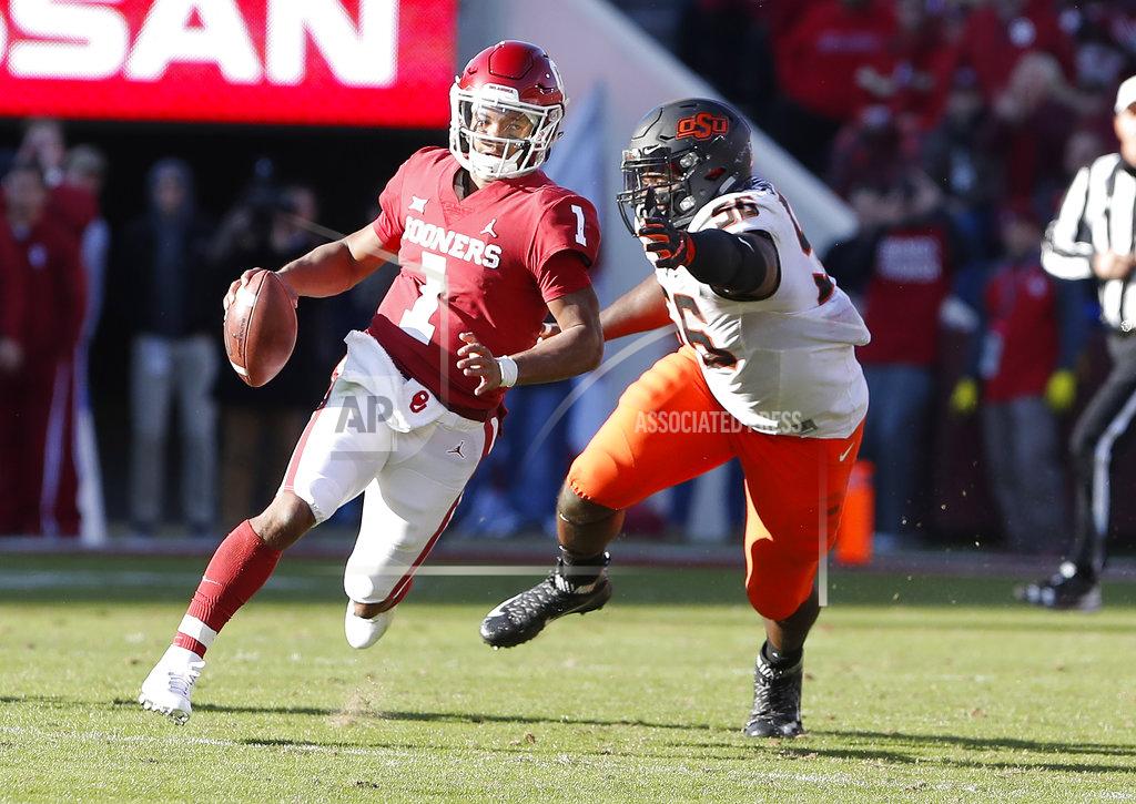 Alonzo Adams Oklahoma quarterback Kyler Murray (1) scrambles for a first down ahead of Oklahoma State defensive tackle Enoch Smith Jr. (56) in the second quarter of an NCAA college football game in Norman, Okla., Saturday, Nov. 10, 2018. (AP Photo/Alonzo Adams)