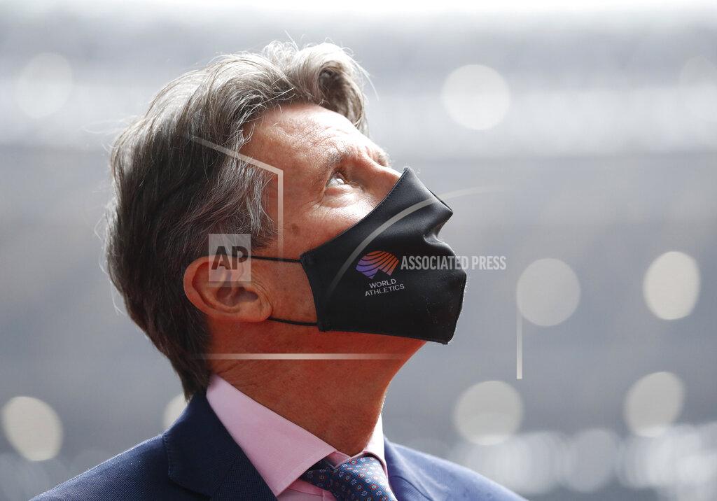 Issei Kato World Athletics President Sebastian Coe wearing a protective face mask inspects at the National Stadium, the main stadium of Tokyo 2020 Olympics and Paralympics, in Tokyo Thursday, Oct. 8, 2020. (Issei Kato/Pool Photo via AP)