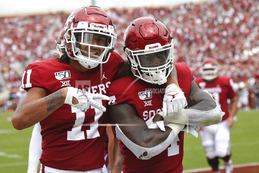 Sue Ogrocki Oklahoma wide receiver Jadon Haselwood (11) and running back Trey Sermon (4) celebrate Sermon's touchdown in the third quarter of an NCAA college football game against Texas Tech in Norman, Okla., Saturday, Sept. 28, 2019. (AP Photo/Sue Ogrocki)
