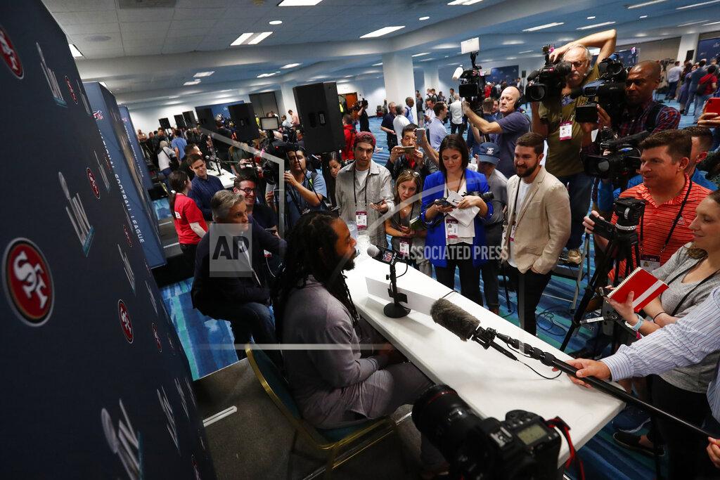 Wilfredo Lee San Francisco 49ers cornerback Richard Sherman, center, answers questions during a media availability for the NFL Super Bowl 54 football game, on Tuesday, Jan. 28, 2020, in Miami. (AP Photo/Wilfredo Lee)