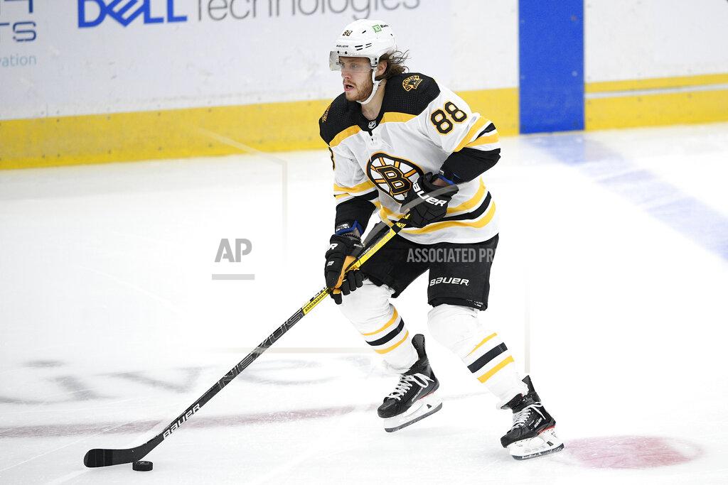 Nick Wass Boston Bruins right wing David Pastrnak (88) skates with the puck during the second period of an NHL hockey game against the Washington Capitals, Saturday, Jan. 30, 2021, in Washington. (AP Photo/Nick Wass)
