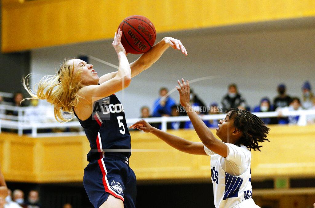 Noah K. Murray Connecticut guard Paige Bueckers (5) is fouled by Seton Hall guard Lauren Park-Lane (3) during the first half of an NCAA college basketball game on Friday, Dec. 3, 2021, in South Orange, N.J. (AP Photo/Noah K. Murray)
