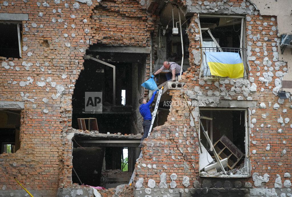 Efrem Lukatsky Residents take out their belongings from their house ruined by the Russian shelling in Irpin close to Kyiv, Ukraine, Saturday, May 21, 2022. (AP Photo/Efrem Lukatsky)