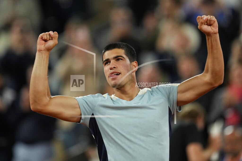 Thibault Camus Spain's Carlos Alcaraz celebrates winning against Sebastian Korda of the U.S. in three sets, 6-4, 6-4, 6-2, during their third round match at the French Open tennis tournament in Roland Garros stadium in Paris, France, Friday, May 27, 2022. (AP Photo/Thibault Camus)