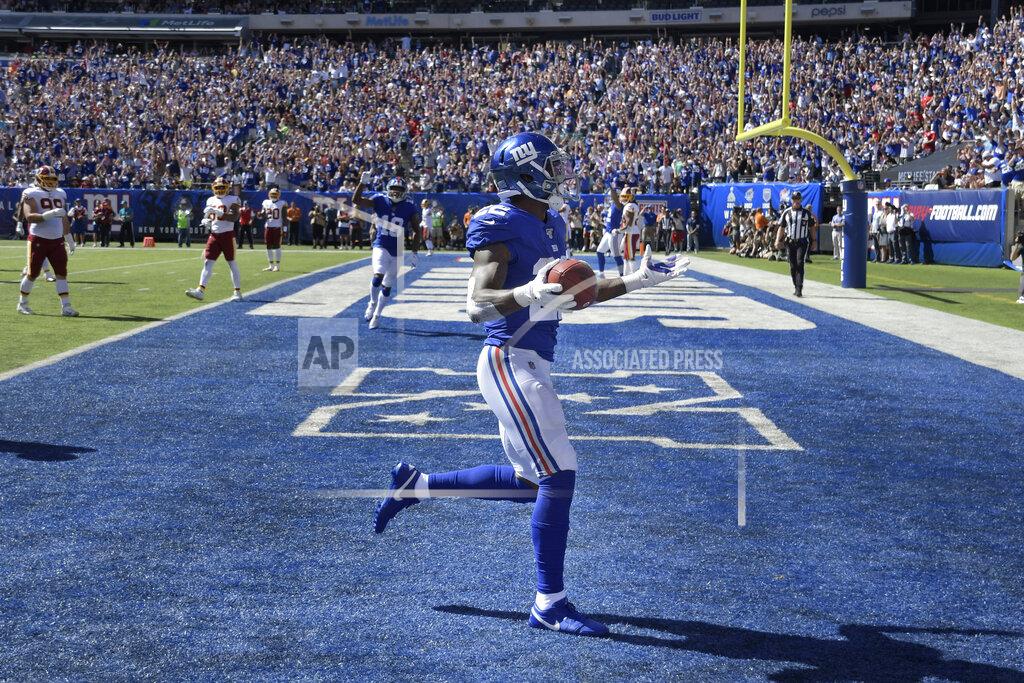 Bill Kostroun New York Giants running back Wayne Gallman reacts after scoring a touchdown during the first half of an NFL football game against the Washington Redskins, Sunday, Sept. 29, 2019, in East Rutherford, N.J. (AP Photo/Bill Kostroun)