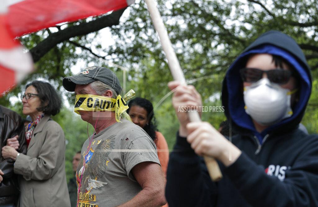 Eric Gay Protesters rally at the Texas State Capitol to speak out against Texas' handling of the COVID-19 outbreak, in Austin, Texas, Saturday, April 18, 2020. Austin and many other Texas cities remain under stay-at-home orders due to the COVID-19 outbreak except for essential personal. (AP Photo/Eric Gay)