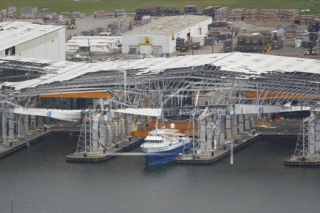 Matt Slocum In this aerial photo, a damaged dock and ship are seen in the aftermath of Hurricane Ida, Monday, Sept. 6, 2021, in Port Fourchon, La. (AP Photo/Matt Slocum)