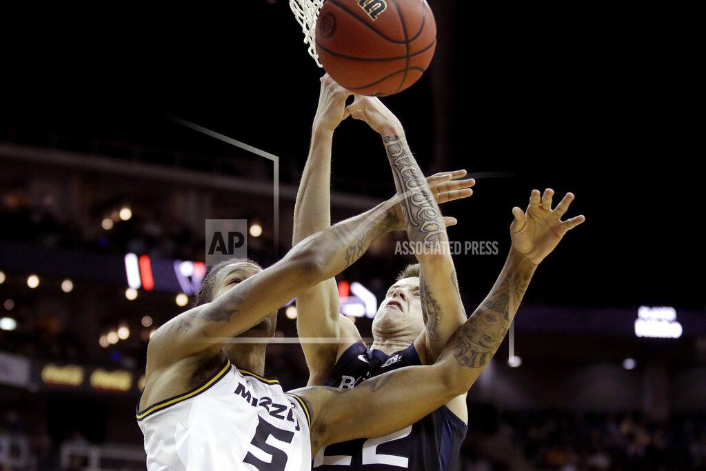 Charlie Riedel Missouri forward Mitchell Smith (5) and Butler forward Sean McDermott (22) battle for a rebound during the first half of an NCAA college basketball game Monday, Nov. 25, 2019, in Kansas City, Mo. (AP Photo/Charlie Riedel)