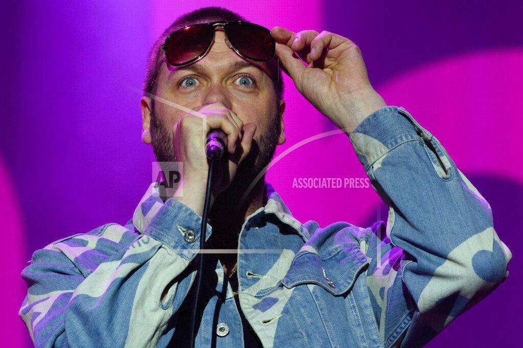 FILE - In this Saturday, Aug. 22, 2015 file photo, Tom Meighan from British band, Kasabian performs on stage during V Festival 2015 at Hylands Park in Chelmsford, Essex, England. British rockers Kasabian said in a statement Monday July 6, 2020, that frontman Tom Meighan has left the band to deal with personal issues. (Photo by Jonathan Short/Invision/AP, File)