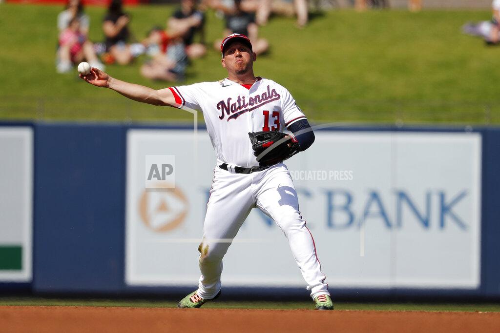 File-This March 2, 2020, file photo shows Washington Nationals third baseman Asdrubal Cabrera throws to first during the fourth inning of a spring training baseball game against the Miami Marlins in West Palm Beach, Fla. The Arizona Diamondbacks have agreed to terms on a $1.75 million, one-year deal with veteran infielder Cabrera, according to a person with knowledge of the negotiations. The agreement was reached on Friday, Feb. 12, 2021, and confirmed by The Associated Press on condition of anonymity because the deal is pending the completion of a successful physical exam. (AP Photo/Jeff Roberson, File)