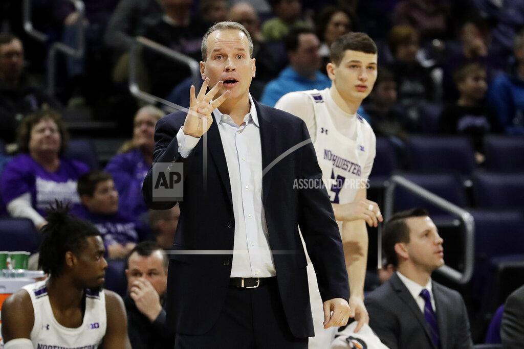Nam Y. Huh Northwestern head coach Chris Collins signals during the first half of an NCAA college basketball game against Minnesota in Evanston, Ill., Sunday, Feb. 23, 2020. (AP Photo/Nam Y. Huh)