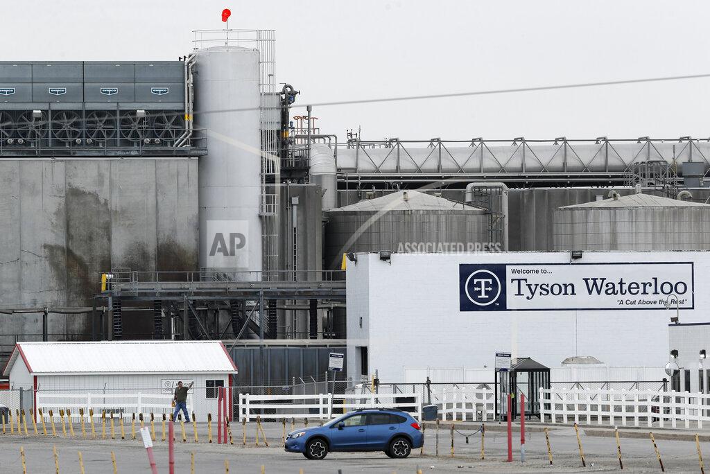 Charlie Neibergall FILE—In this Friday, May 1, 2020, photo, a worker leaves the Tyson Foods plant in Waterloo, Iowa. The coronavirus devastated the nation's meatpacking communities in Iowa, Nebraska, and Minnesota earlier in the year. Behemoths like Walmart and Tyson, which have been the target of COVID-19-related lawsuits, can largely absorb any losses. But hundreds of negligence lawsuits have been filed across the country, with mom-and-pops most fearing the prospect of litigation that could put them under. (AP Photo/Charlie Neibergall, File)