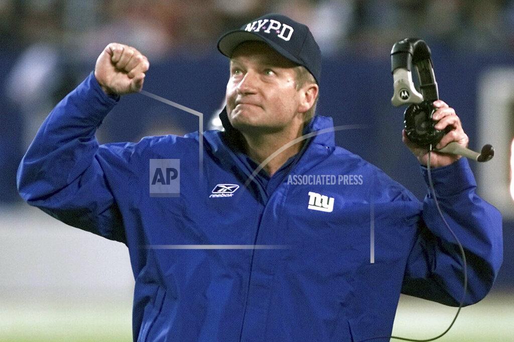 Jeff Zelevansky FILE - New York Giants head coach Jim Fassel reacts after referees overturned a ruling on a completed Philadelphia Eagles pass in the fourth quarter at Giants Stadium in East Rutherford, N.J., in this Monday, Oct. 22, 2001, file photo. Fassel, a former coach of the New York Giants who was named NFL coach of the year in 1997 and led the team to the 2001 Super Bowl, has died. He was 71. Fassel's son, John, confirmed the death to the Los Angeles Times on Monday, June 7, 2021. According to the Los Angeles Times, Fassel was taken to a hospital in Las Vegas with chest pains and died of a heart attack. (AP Photo/Jeff Zelevansky, File)