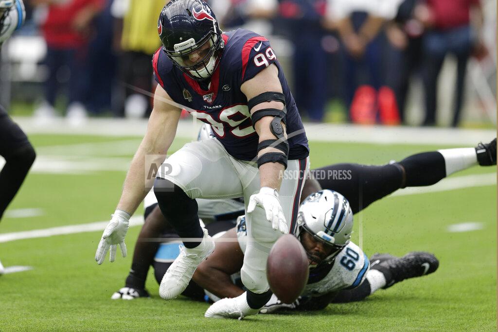 Michael Wyke Houston Texans defensive end J.J. Watt (99) and Carolina Panthers offensive tackle Daryl Williams (60) chase a fumble during the second half of an NFL football game Sunday, Sept. 29, 2019, in Houston. Watt recovered the ball. (AP Photo/Michael Wyke)