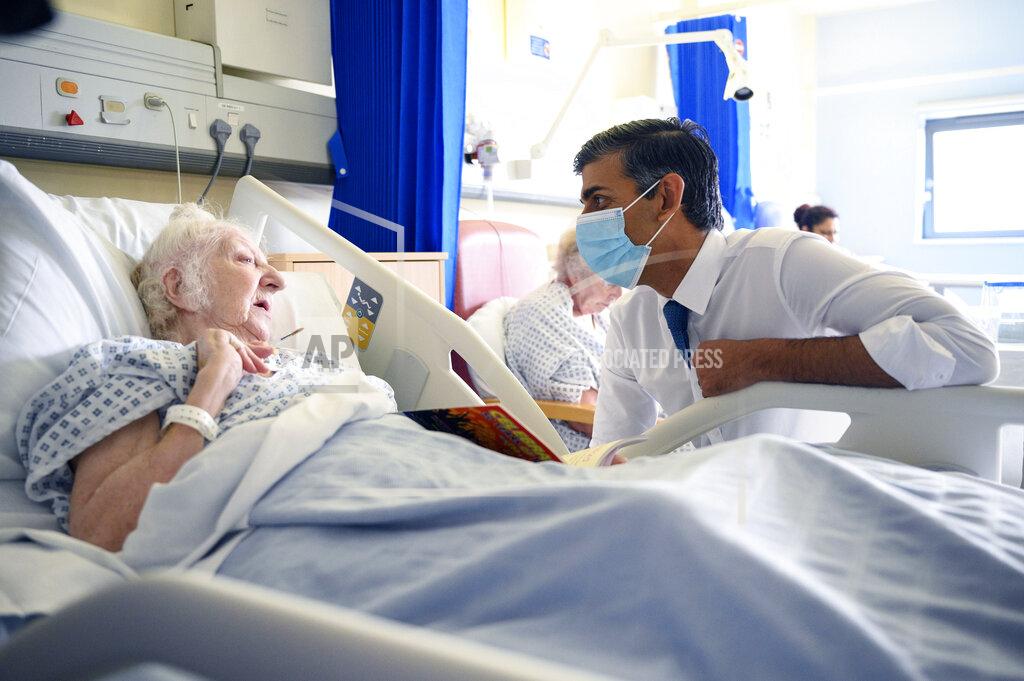 Leon Neal FILE - Britain's Prime Minister Rishi Sunak speaks with patient Brenda Boyling as he visits Croydon University hospital, in south London, Oct. 28, 2022. In his first month as Britain's prime minister, Rishi Sunak has stabilized the economy, reassured allies from Washington to Kyiv and even soothed the European Union after years of sparring between Britain and the bloc. But Sunak’s challenges are just beginning. He is facing a stagnating economy, a cost-of-living crisis – and a Conservative Party that is fractious and increasingly unpopular after 12 years in power. (Leon Neal/Pool Photo via AP, File)
