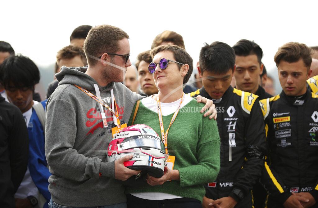 Francisco Seco The mother and brother of Anthoine Hubert hold the helmet of Anthoine Hubert during a moment of silence at the Belgian Formula One Grand Prix circuit in Spa-Francorchamps, Belgium, Sunday, Sept. 1, 2019. The 22-year-old Hubert died following an estimated 160 mph (257 kph) collision on Lap 2 at the high-speed Spa-Francorchamps track, which earlier Saturday saw qualifying for Sunday's Formula One race. (AP Photo/Francisco Seco)
