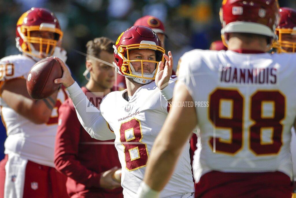 Aaron Gash Washington Football Team's Kyle Allen warms up before an NFL football game against the Green Bay Packers Sunday, Oct. 24, 2021, in Green Bay, Wis. (AP Photo/Aaron Gash)
