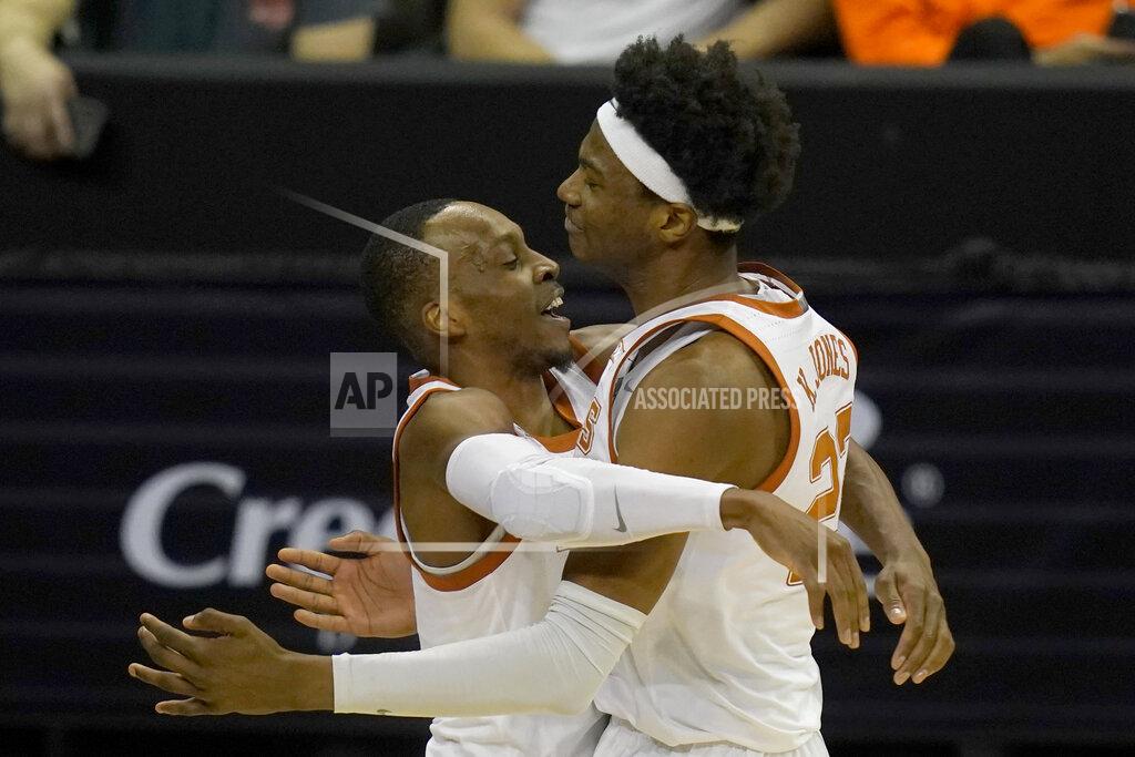 Orlin Wagner Texas guard Matt Coleman III, left, celebrates with forward Kai Jones (22) following an NCAA college basketball game against Texas Tech in the quarterfinal round of the Big 12 men's tournament in Kansas City, Mo., Thursday, March 11, 2021. Texas defeated Texas Tech 67-66. (AP Photo/Orlin Wagner)