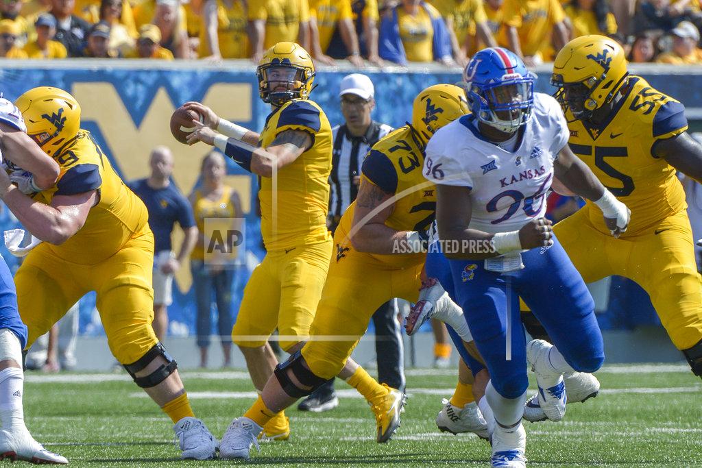 Craig Hudson West Virginia quarterback Will Grier (7) looks for a receiver during the first half of an NCAA college football game against Kansas in Morgantown, W. Va., Saturday Oct. 6, 2018. (AP Photo/Craig Hudson)