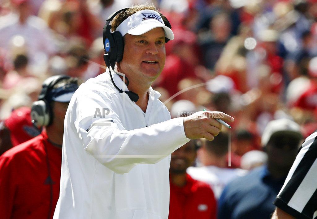 Sue Ogrocki FILE - In this Sept. 1, 2018, file photo, Florida Atlantic head coach Lane Kiffin gestures in the first half of an NCAA college football game against Oklahoma in Norman, Okla. Florida Atlantic entered the season with aspirations of playing its way into the debate about who's worthy of berths in the College Football Playoff. The Owls' chances already have taken a hit, however they still have plenty of motivation heading into a visit to No. 16 UCF. (AP Photo/Sue Ogrocki, File)