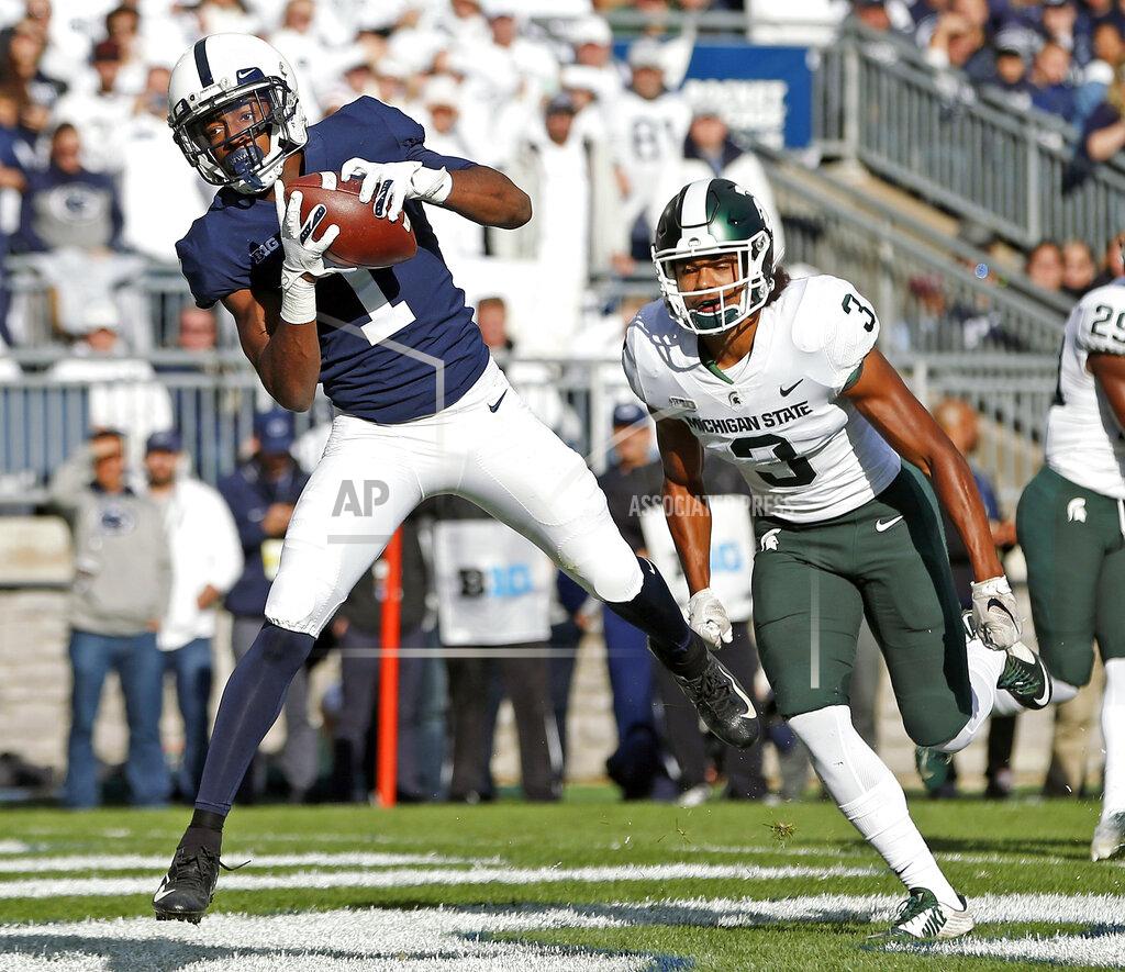 Chris Knight Penn State's KJ Hamler (1) catches a touchdown pass in front of Michigan State's Xavier Henderson (3) during the first half of an NCAA college football game in State College, Pa., Saturday, Oct. 13, 2018. (AP Photo/Chris Knight)