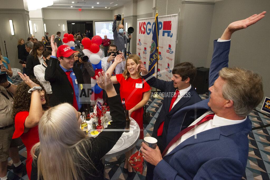 Evert Nelson Congressman Roger Marshall goes hands in with college students prior to results at a GOP watch party at the Cyrus Hotel Tuesday evening, Nov. 3, 2020 in Topeka, Kan. Marshall is running against Barbara Bollier for the Kansas seat in the U.S. Senate. (Evert Nelson/The Topeka Capital-Journal via AP)