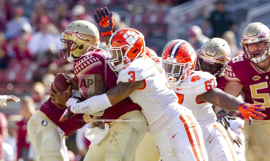 Mark Wallheiser Clemson defensive end Xavier Thomas (3) and Albert Huggins sack Florida State quarterback Deondre Francois in the second half of an NCAA college football game in Tallahassee, Fla., Saturday, Oct. 27, 2018. Clemson defeated Florida State 59-10. (AP Photo/Mark Wallheiser)