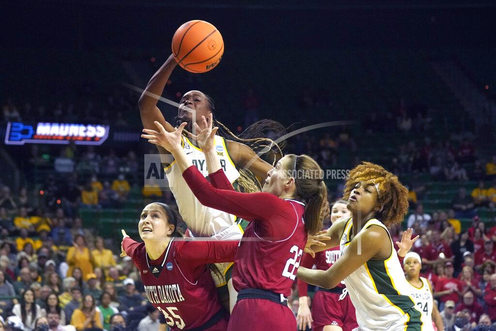 Lm Otero Baylor center Queen Egbo, top, tries to reach a rebound against South Dakota forward Allison Peplowski (35) and guard Chloe Lamb (22) as Baylor forward NaLyssa Smith, right, looks on during the second half of a college basketball game in the second round of the NCAA tournament in Waco, Texas, Sunday, March 20, 2022. (AP Photo/LM Otero)