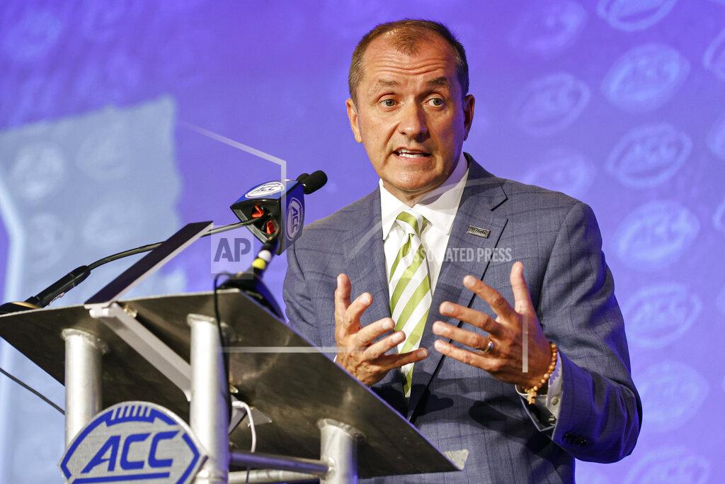 Nell Redmond Atlantic Coast Conference commissioner Jim Phillips answers a question during an NCAA college football news conference at the ACC media days in Charlotte, N.C., Wednesday, July 20, 2022. (AP Photo/Nell Redmond)