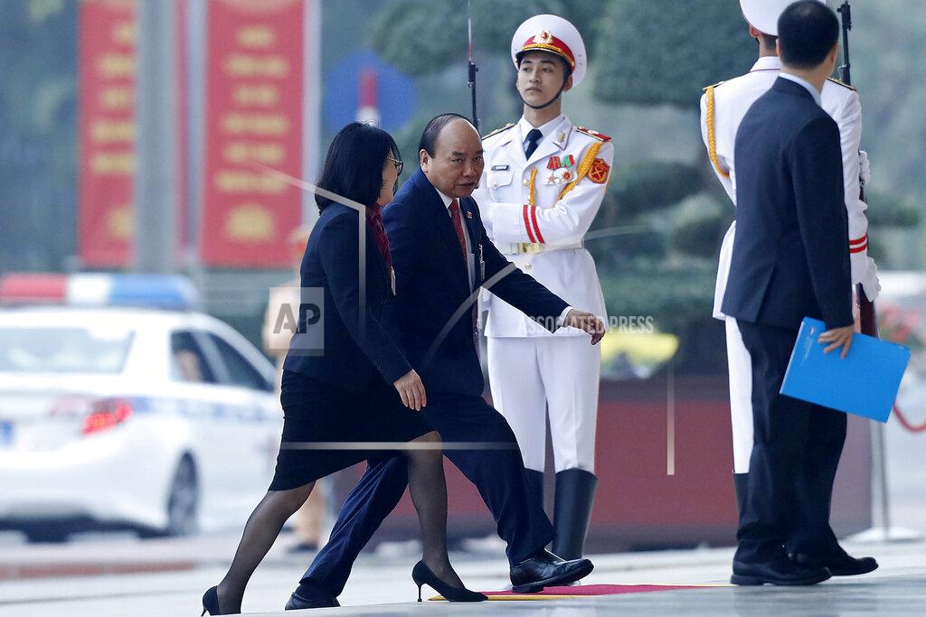 Minh Hoang Vietnam's Prime Minister Nguyen Xuan Phuc, second left, arrives for the opening ceremony of the 13th National Congress of Vietnam's Communist Party (VCP), in Hanoi, Vietnam Tuesday, Jan. 26, 2021. (AP Photo/Minh Hoang)
