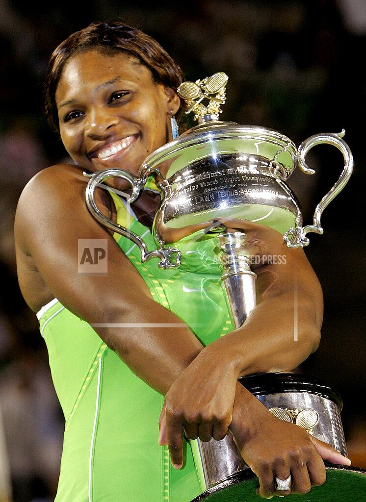 Rick Stevens FILE - Serena Williams hugs the Australian Open trophy after defeating Maria Sharapova of Russia in their women's singles final match at the Australian Open tennis tournament in Melbourne, Australia, Saturday, Jan. 27, 2007. Williams won the final, 6-1 6-2. The 2022 Wimbledon competition is not the first comeback from a significant absence for Williams. (AP Photo/Rick Stevens, File)