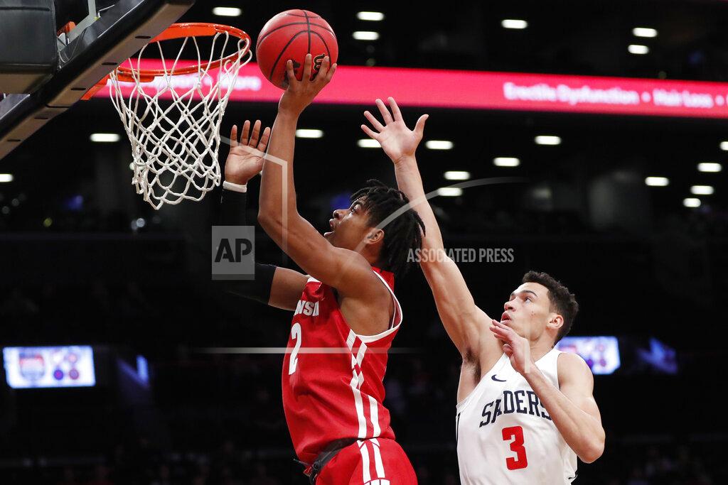 Kathy Willens Wisconsin forward Aleem Ford (2) shoots for two points with Richmond forward Tyler Burton (3) defending during the first half of an NCAA college basketball game in the Legends Classic, Monday, Nov. 25, 2019, in New York. (AP Photo/Kathy Willens)