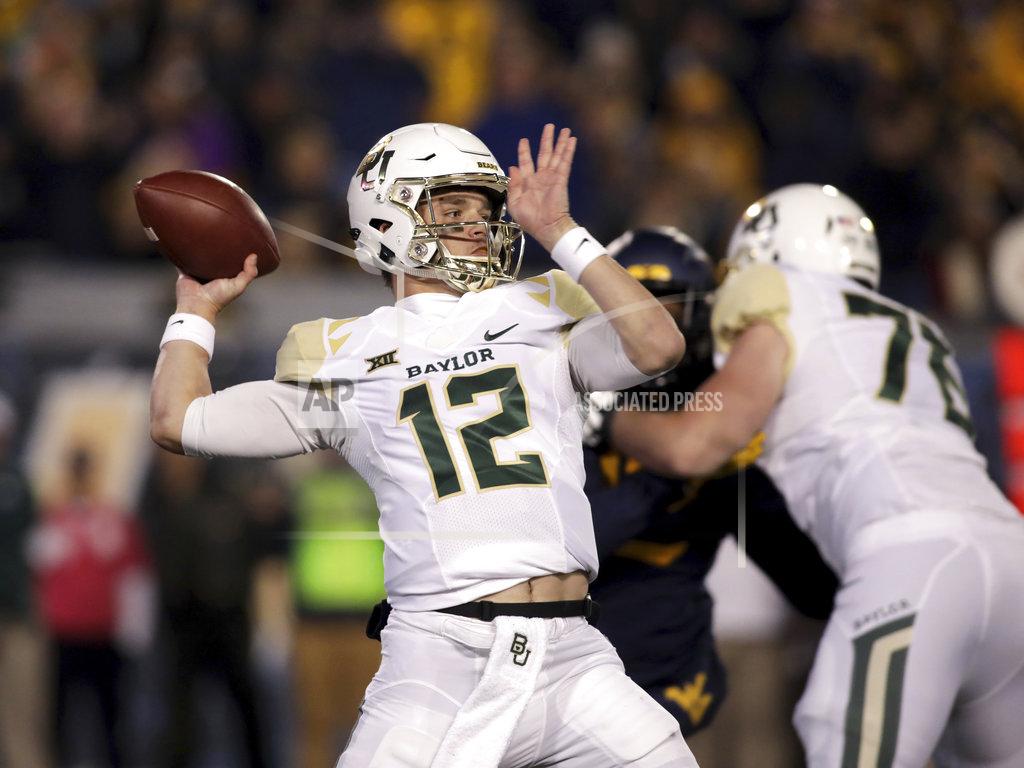 Ray Thompson Baylor quarterback Charlie Brewer (12) looks to pass during the first half of an NCAA college football game against West Virginia, Thursday, Oct. 25, 2018, in Morgantown, W.Va. (AP Photo/Raymond Thompsonr