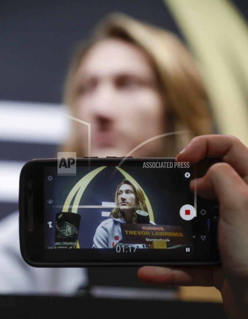 David J. Phillip Clemson's Trevor Lawrence answers questions during media day for the NCAA college football playoff championship game Saturday, Jan. 5, 2019, in Santa Clara, Calif. (AP Photo/David J. Phillip)