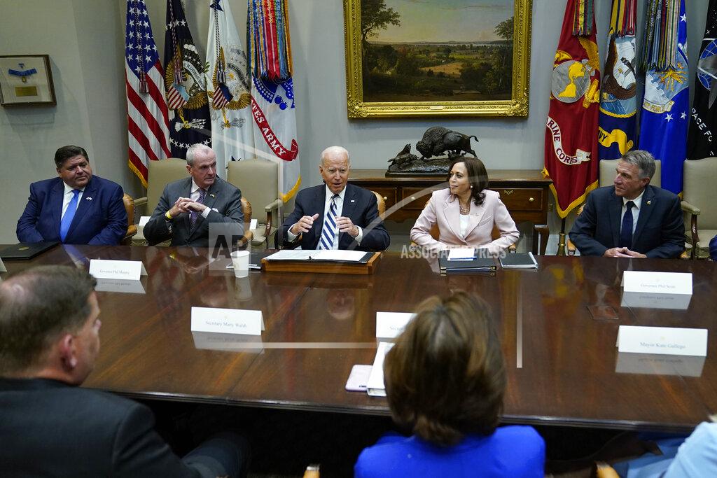 Susan Walsh FILE - In this July 14, 2021, file photo President Joe Biden, center, speaks during a meeting with a bipartisan group of governors and mayors and cabinet officials in the Roosevelt room of the White House in Washington to discuss the bipartisan infrastructure deal in the Senate. Biden is flanked by New Jersey Gov. Phil Murphy, left, and Vice President Kamala Harris, right. (AP Photo/Susan Walsh, File)