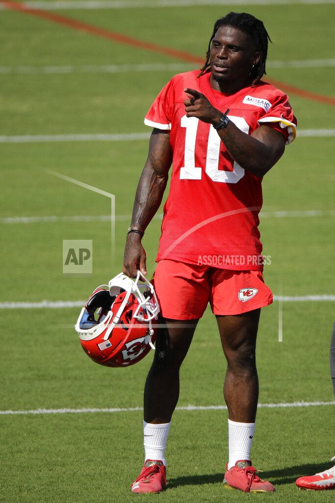 Kansas City Chiefs wide receiver Tyreek Hill motions to a teammate at NFL football training camp Saturday, July 27, 2019, in St. Joseph, Mo. (AP Photo/Charlie Riedel)