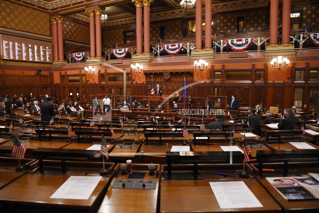 Jessica Hill New Speaker of the House Matt Ritter, D-Hartford speaks in a mostly empty House during opening session at the State Capitol, Wednesday, Jan. 6, 2021, in Hartford, Conn. Many legislators are watching via Zoom in the new legislative session that is expected to focus on the continuing coronavirus pandemic and the state's budget challenges. (AP Photo/Jessica Hill)