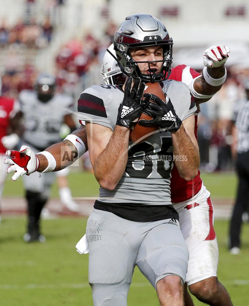 Rogelio V. Solis Mississippi State wide receiver Austin Williams (85) holds on to a touchdown pass as an Arkansas defender tries to reach around and strip him of the ball during the second half of an NCAA college football game in Starkville, Miss., Saturday, Nov. 17, 2018. Mississippi State won 52-6.(AP Photo/Rogelio V. Solis)