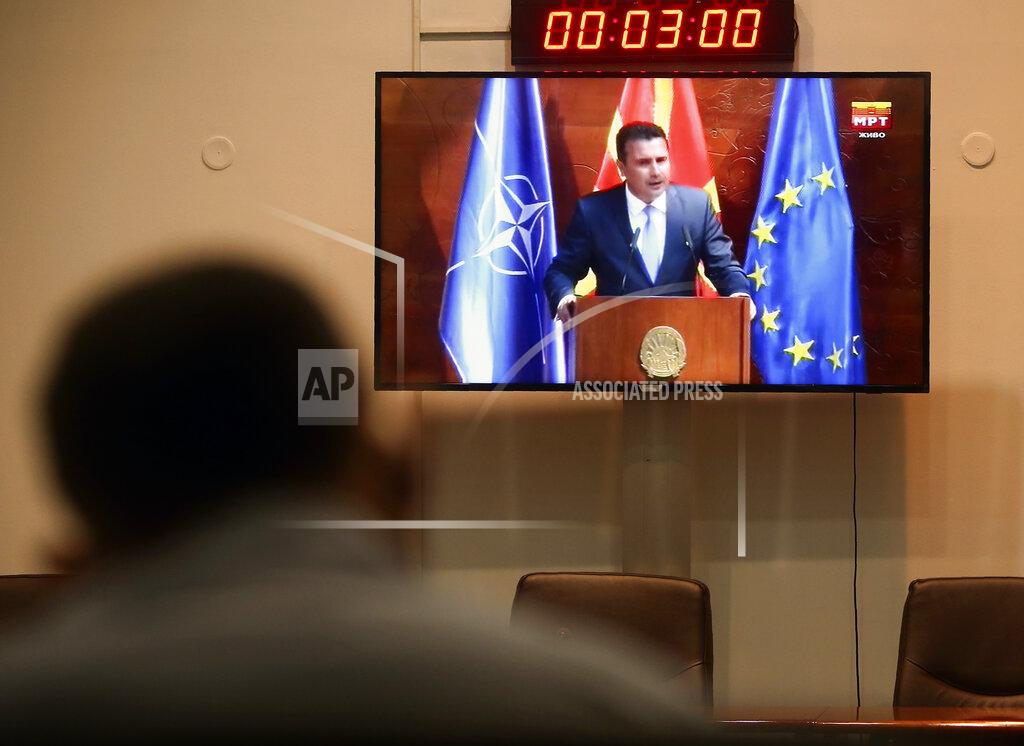 Boris Grdanoski A journalist follows the session of the Parliament through a screen in the media center as Zoran Zaev, the Social-Democrat leader and candidate for Prime Minister, talks to the lawmakers, in the parliament building in Skopje, North Macedonia, Sunday, Aug. 30, 2020. North Macedonia's parliament continues Sunday the debate on a vote of confidence for a new left-wing coalition government after the Social Democrats and their ethnic Albanian partners secured a majority of seats in July's general election. (AP Photo/Boris Grdanoski)