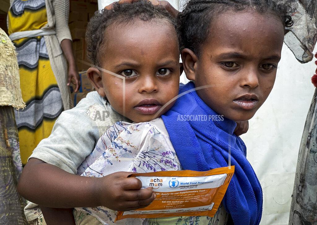 Claire Nevill Children who are either suffering from or at risk of malnourishment receive nutrient supplements from the World Food Programme (WFP) in the Adi Daero district, the first time the community has received nutrition support, in the Tigray region of northern Ethiopia Saturday, Aug. 21, 2021. For months, the United Nations has warned of famine in Tigray and now internal documents and witness accounts reveal the first starvation deaths since Ethiopia's government in June imposed what the U.N. calls "a de facto humanitarian aid blockade." (Claire Nevill/WFP via AP)